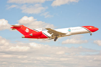 Low angle view of airplane flying in sky