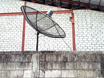 Low angle view of basketball hoop against wall