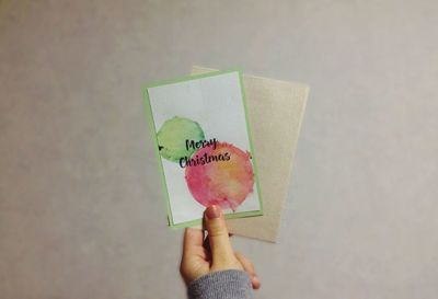 Midsection of man holding paper