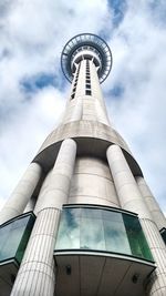 Low angle view of tower against cloudy sky