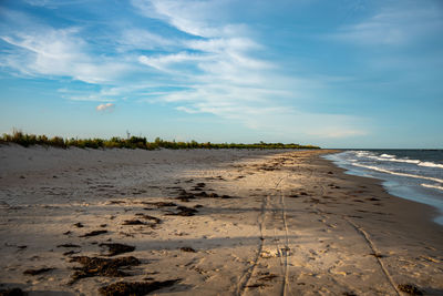 Scenic view of beach against sky