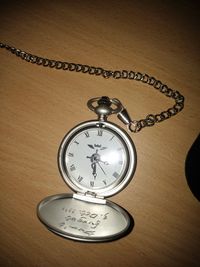 Close-up of clock on table