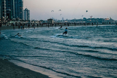 Group of people in front of sea