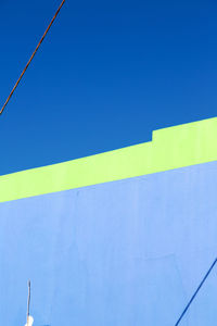 Low angle view of building against blue sky