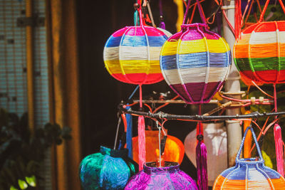 Close-up of amusement park hanging at market stall