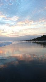 Scenic view of sea against sky at sunset