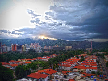 Buildings in city at sunset