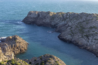 High angle view of rock formation in sea