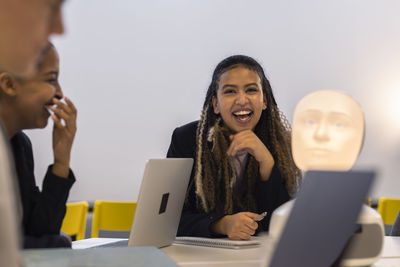 Business people laughing during business meeting