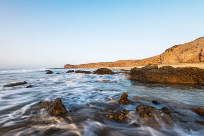 Scenic view of sea against clear sky