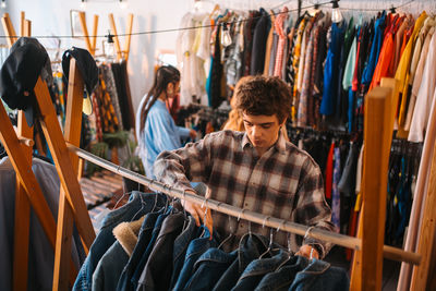 Low angle view of young man standing in factory
