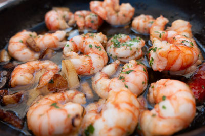 Close-up of prawns in utensil