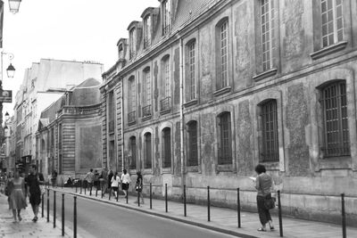 People walking on street in city