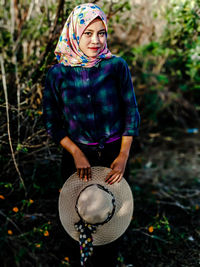 Full length of woman standing on field