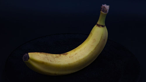 High angle view of bananas against black background