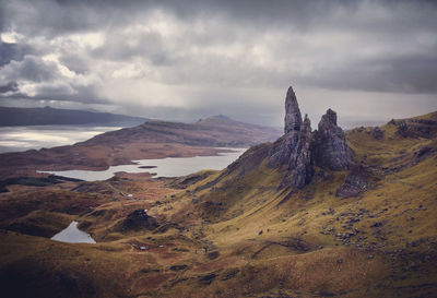 Scenic view of mountains against cloudy sky