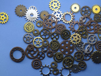Close-up of gears on blue table