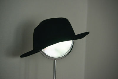 Close-up of hat against wall