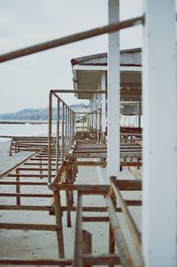 Staircase by sea against sky