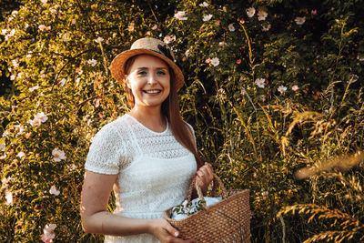 Portrait of smiling young woman in park