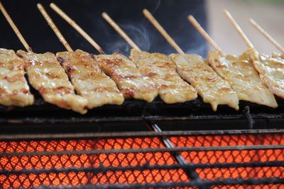 Close-up of meat on barbecue grill