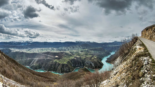Panoramic view of landscape against cloudy sky