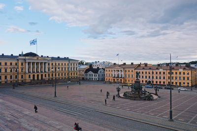 People in city against sky