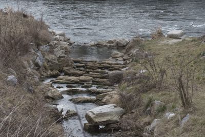 High angle view of water flowing through rocks