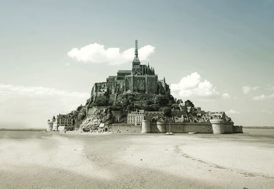 View of temple against cloudy sky