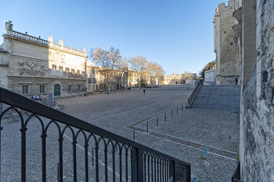 Buildings in city against clear sky