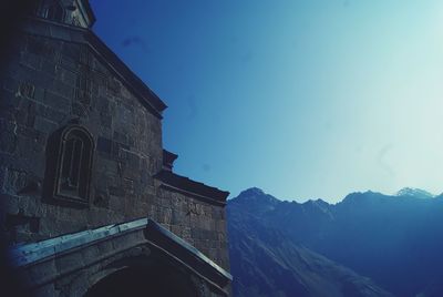 Low angle view of building against blue sky