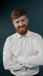 Portrait smiling of man against colored background