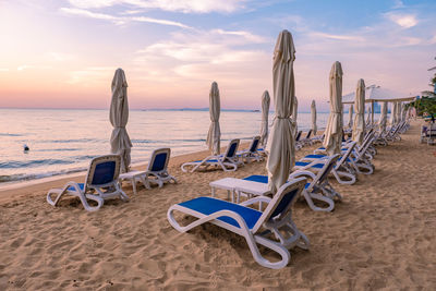 Scenic view of beach against sky during sunset