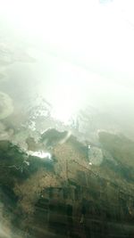 Aerial view of snowcapped landscape against sky