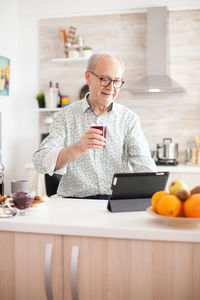 Man using mobile phone at home