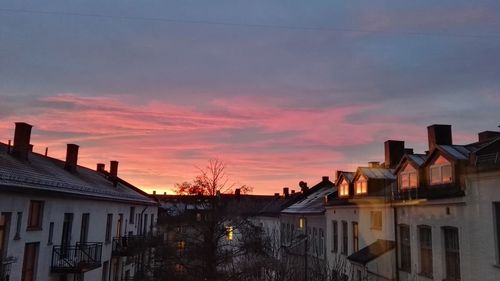 Houses in city at sunset