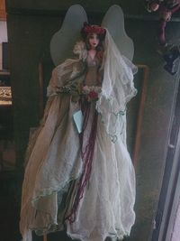 Midsection of woman standing in temple