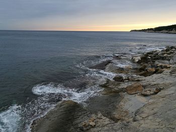 Scenic view of sea against sky during sunset