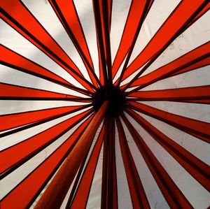 Low angle view of white and red umbrella