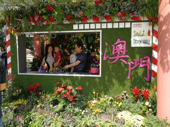 Group of people on plants against building