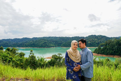 A muslim asian couple husband and wife posing happily