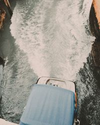 High angle view of lounge chair by sea