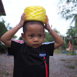 Portrait of cute boy standing outdoors
