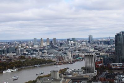 Aerial view of buildings in london against sky