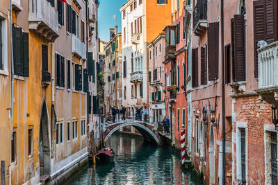 Grand canal amidst buildings against sky