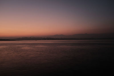 Scenic view of sea against clear sky during sunset