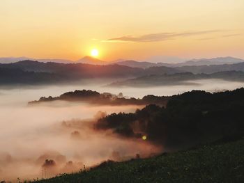 Scenic view of mountains against sky during sunset