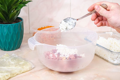 Cropped hand of woman washing hands