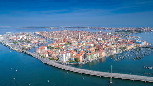 High angle view of canal amidst buildings in city