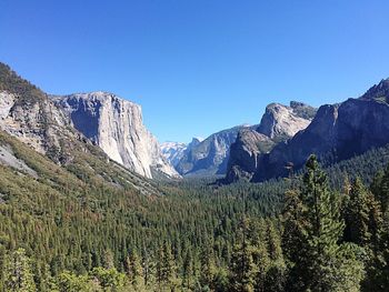 Scenic view of mountains against clear blue sky